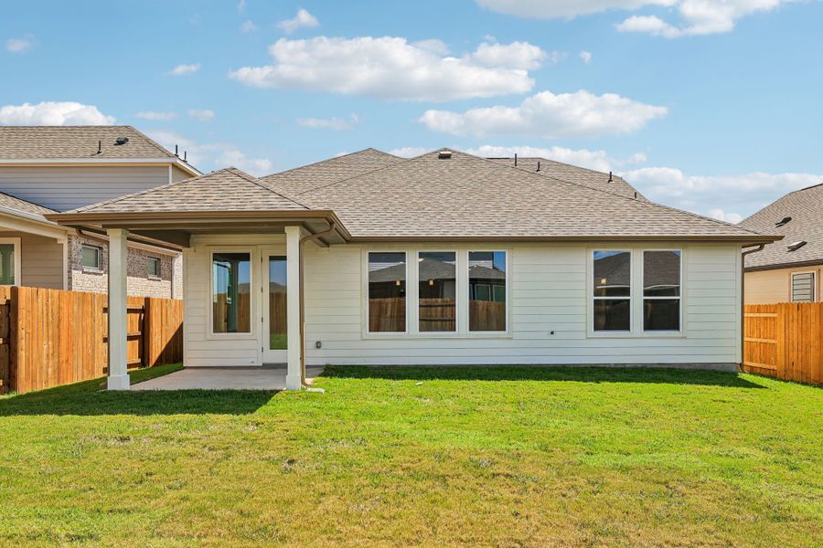 Exterior details and patio area of a home in Freedom at Anthem, Kyle (Image 3).