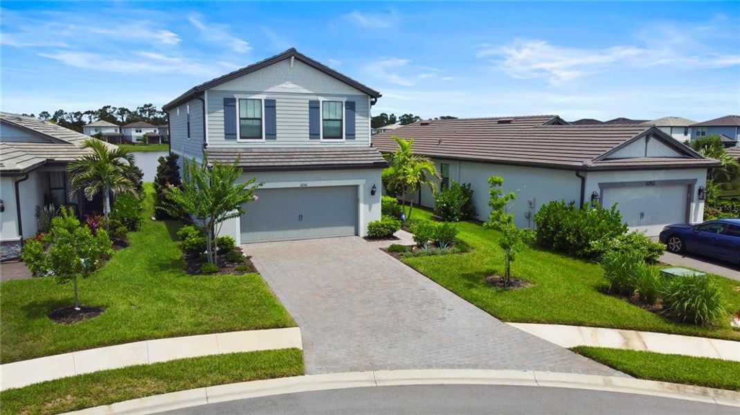 Front exterior of a new home in , Lakewood Ranch, FL, highlighting curb appeal (Image 2).