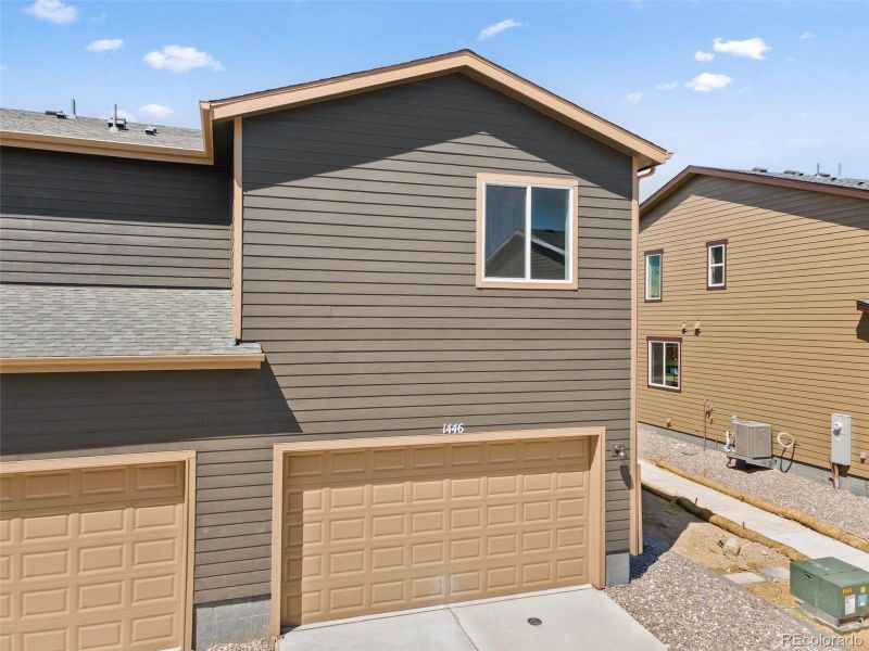Front exterior of a new home in Spring Valley, Longmont, CO, highlighting curb appeal (Image 20).