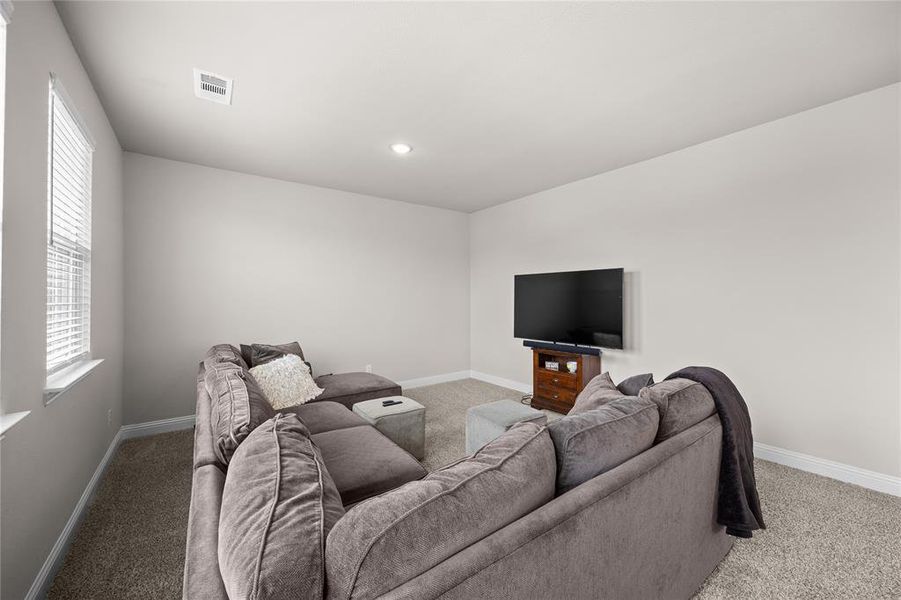This spacious game room is the ultimate flex space, perfectly tucked away over the garage and just off the entrance to ensure loud game nights, movie marathons, or kids being kids won't disrupt the rest of the house. With its elevated and isolated positioning, you can enjoy maximum fun with zero noise carrying downstairs—making it a true entertainer's retreat or peaceful sanctuary.