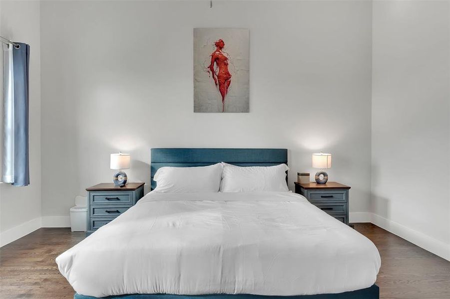 Bedroom featuring dark wood-type flooring
