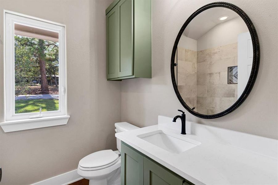 Full bathroom featuring vanity and healthy amount of natural light Full bathroom featuring vanity and healthy amount of natural light