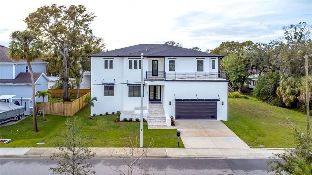 Front exterior of a new home in , Tampa, FL, highlighting curb appeal (Image 1).