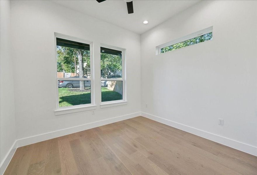 Secondary bedroom on first floor overlooks the front yard