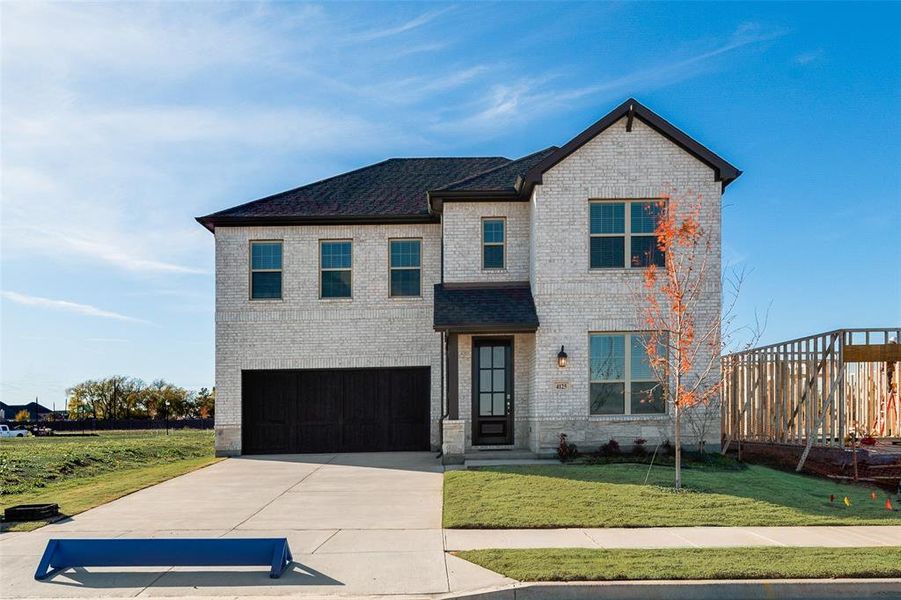 Front exterior of a new home in Sutton Fields, Celina, TX, highlighting curb appeal (Image 2). Front exterior of a new home in Sutton Fields, Celina, TX, highlighting curb appeal (Image 2).