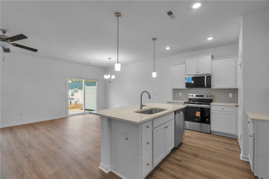 This bright, open concept living space features a This bright, open concept living space features a