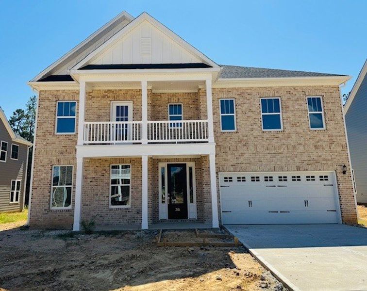 Front exterior of a new home in Pebble Branch, Chapin, SC, highlighting curb appeal (Image 1).