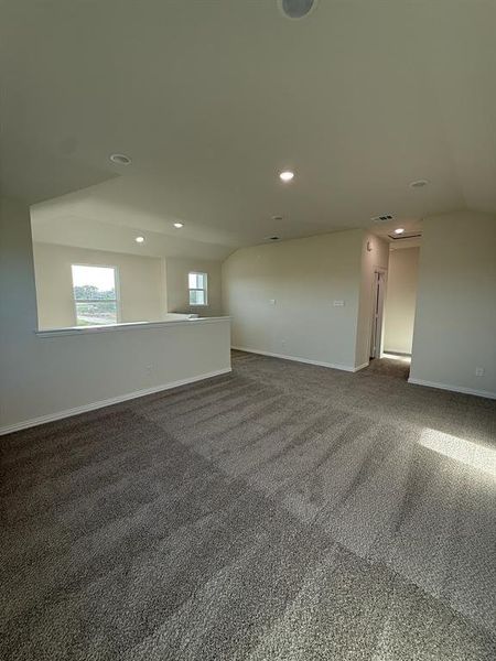 game room/media room(upstairs) featuring vaulted ceiling and recessed lighting game room/media room(upstairs) featuring vaulted ceiling and recessed lighting