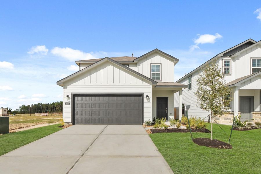 Front exterior of a new home in Northpark South, Porter, TX, highlighting curb appeal (Image 2). Front exterior of a new home in Northpark South, Porter, TX, highlighting curb appeal (Image 2).