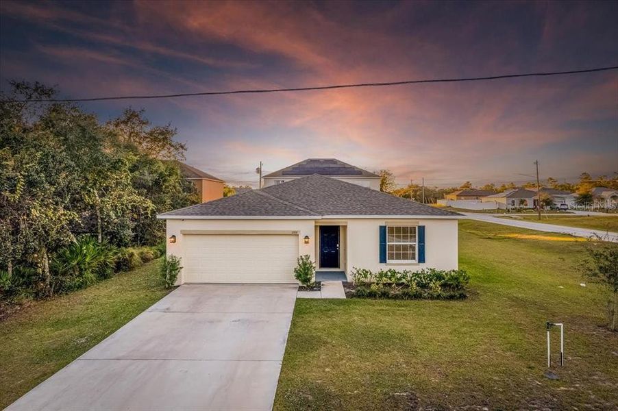 Front exterior of a new home in Poinciana, Poinciana, FL, highlighting curb appeal (Image 23). Front exterior of a new home in Poinciana, Poinciana, FL, highlighting curb appeal (Image 23).