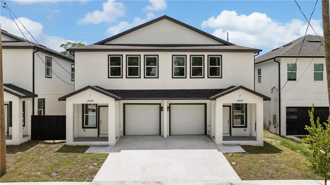 Front exterior of a new home in , Tampa, FL, highlighting curb appeal (Image 2). Front exterior of a new home in , Tampa, FL, highlighting curb appeal (Image 2).