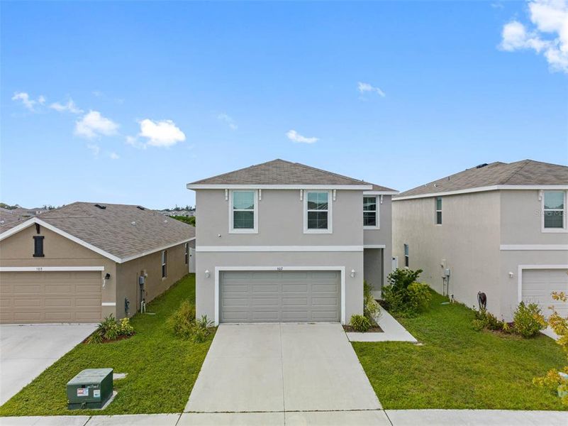 Front exterior of a new home in , Ruskin, FL, highlighting curb appeal (Image 28). Front exterior of a new home in , Ruskin, FL, highlighting curb appeal (Image 28).