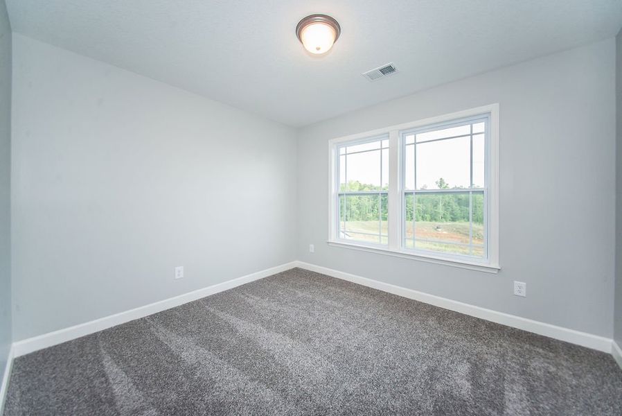 Representative unfurnished interior of a home built from the Heatherwood by Enchanted Homes in Ballentine Ridge, Lyman (Image 20).