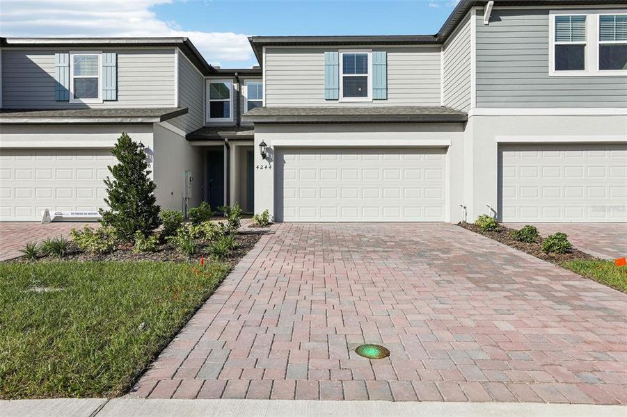 Exterior details and patio area of a home in The Meadow at Crossprairie Bungalows, St. Cloud (Image 35).