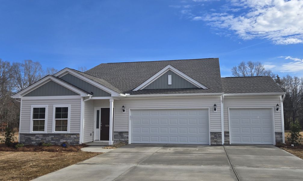 Front exterior of a new home in Burke Estates, Chesnee, SC, highlighting curb appeal (Image 1). Front exterior of a new home in Burke Estates, Chesnee, SC, highlighting curb appeal (Image 1).