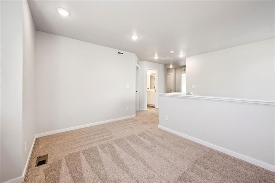 A hallway with white walls. A hallway with white walls.