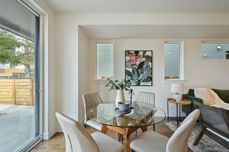 Dining room opens onto covered front porch and yard