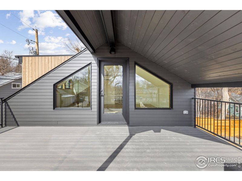 Studio deck partially covered and structurally designed for hot tub.