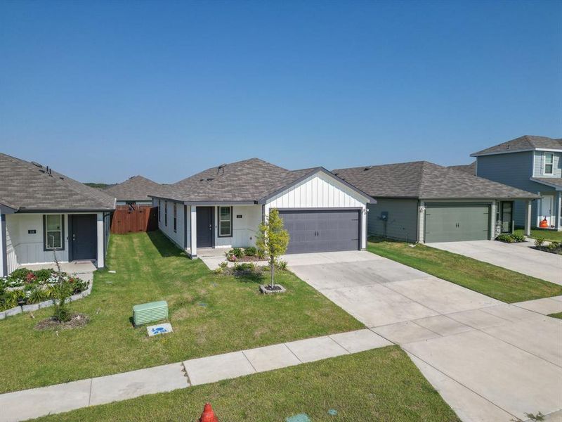 Front exterior of a new home in Wildwood, Royse City, TX, highlighting curb appeal (Image 22).