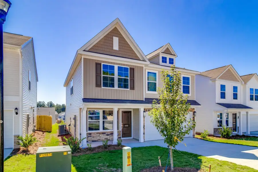 Front exterior of a new home in Bluefield, Lexington, SC, highlighting curb appeal (Image 18).