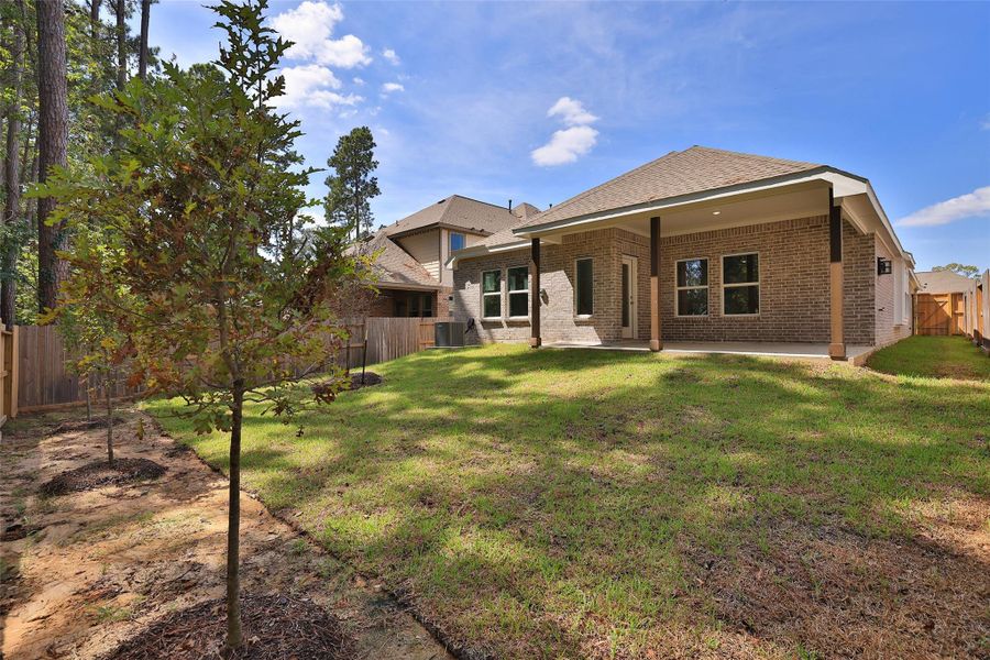 Exterior details and patio area of a home in The Woodlands Hills, Willis (Image 3). Exterior details and patio area of a home in The Woodlands Hills, Willis (Image 3).