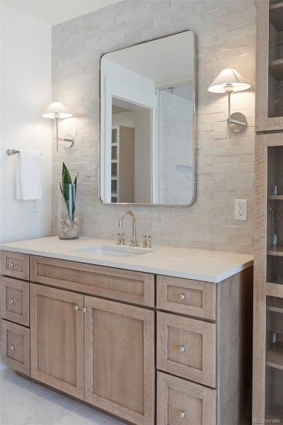 Stunning double vanities + tower cabinet