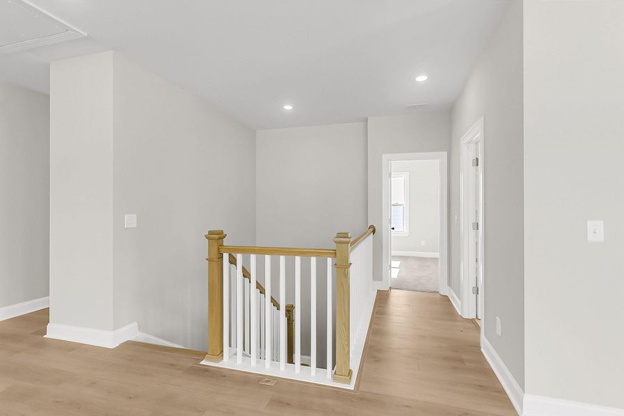 Spacious, unfurnished interior of a new home in Tidewater at Lakes of Cane Bay, Summerville (Image 49).