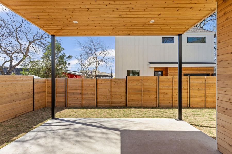 View of patio with a fenced backyard