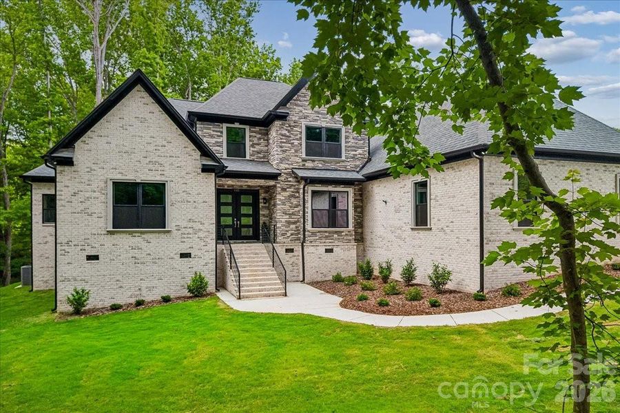 Front exterior of a new home in , Waxhaw, NC, highlighting curb appeal (Image 24).
