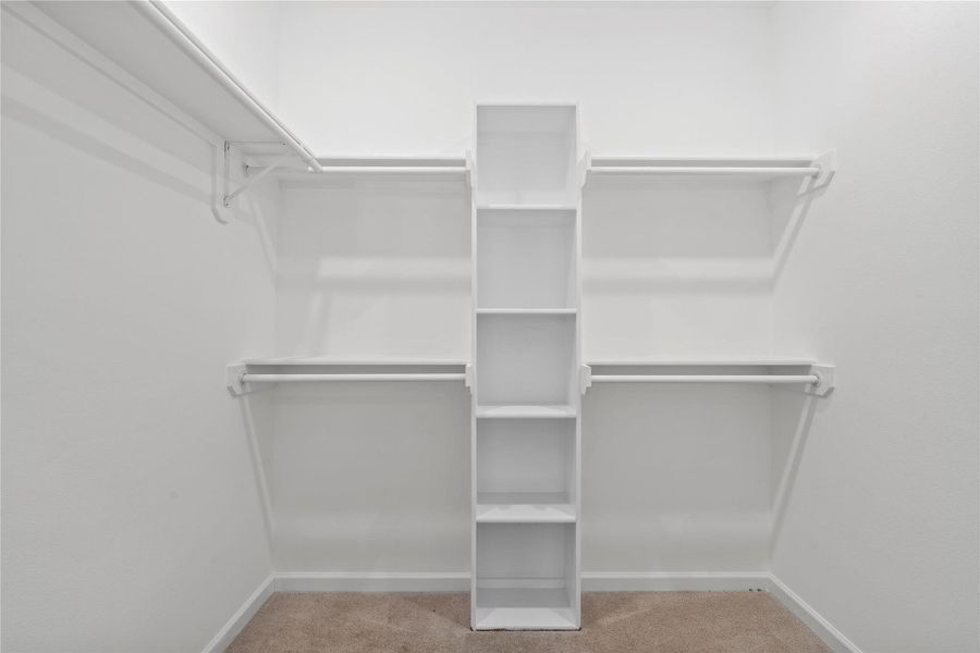 Walk-in closet with built-in shelving already done—no extra spend on organizers, just move in and unpack. Walk-in closet with built-in shelving already done—no extra spend on organizers, just move in and unpack.