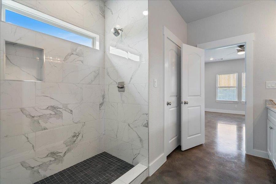 Relax and unwind in the graceful walk-in shower after a long day. Relax and unwind in the graceful walk-in shower after a long day.