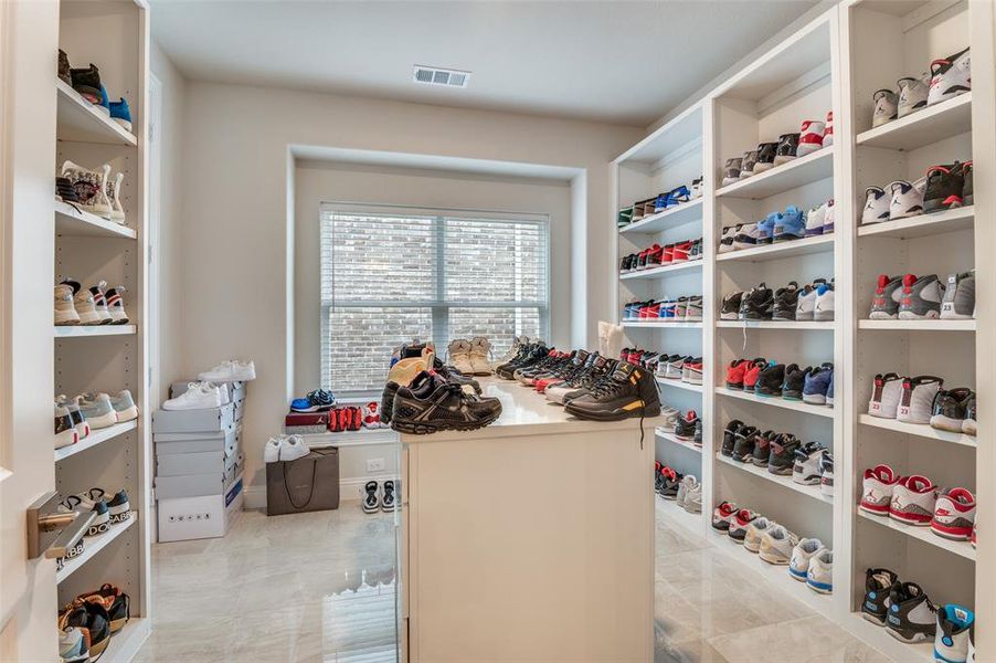 Walk in closet featuring light tile patterned flooring