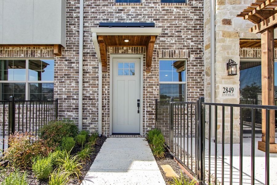 Exterior details and patio area of a home in The Tribute, The Colony (Image 26).