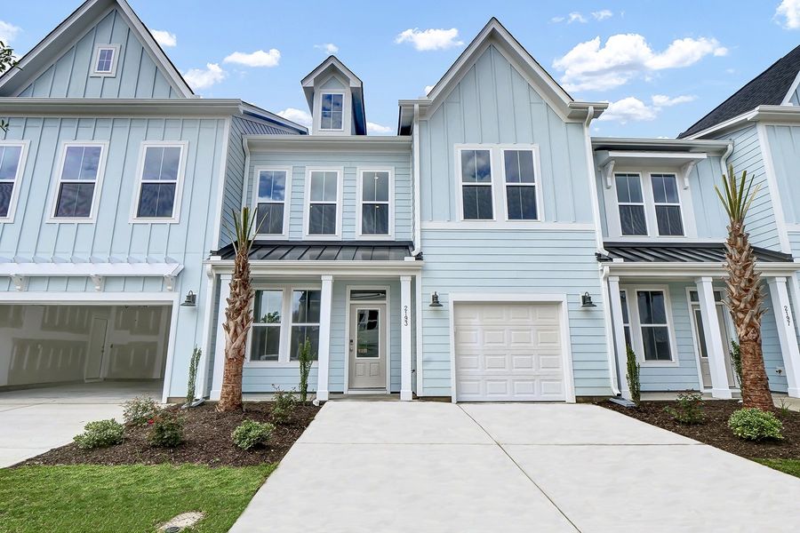 Front exterior of a new home in Grand Park, Leland, NC, highlighting curb appeal (Image 1).