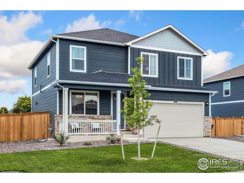 Front exterior of a new home in Mountain View Ranch, Wellington, CO, highlighting curb appeal (Image 22). Front exterior of a new home in Mountain View Ranch, Wellington, CO, highlighting curb appeal (Image 22).
