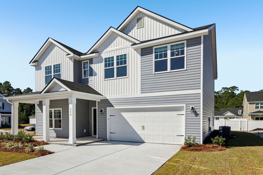 Front exterior of a new home in Hayden Pointe, St. Marys, GA, highlighting curb appeal (Image 1). Front exterior of a new home in Hayden Pointe, St. Marys, GA, highlighting curb appeal (Image 1).
