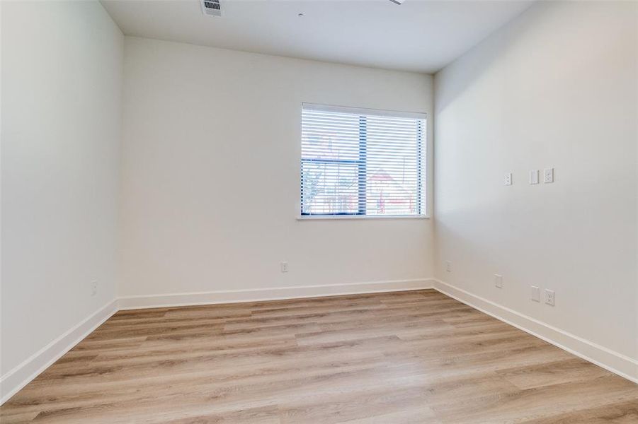 Unfurnished room featuring light hardwood / wood-style floors