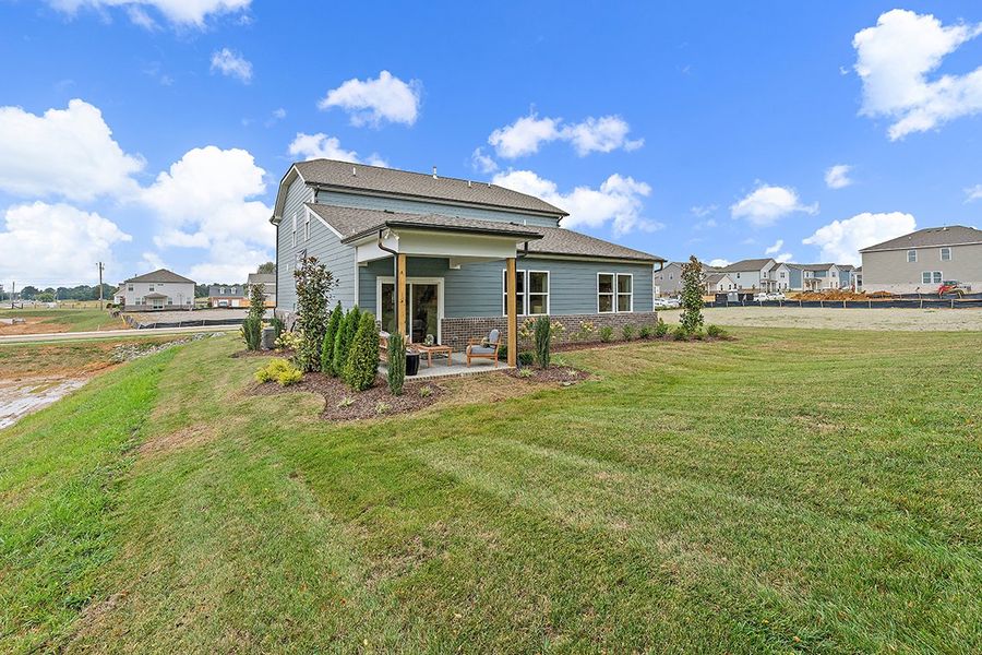 A house with a grass yard. A house with a grass yard.