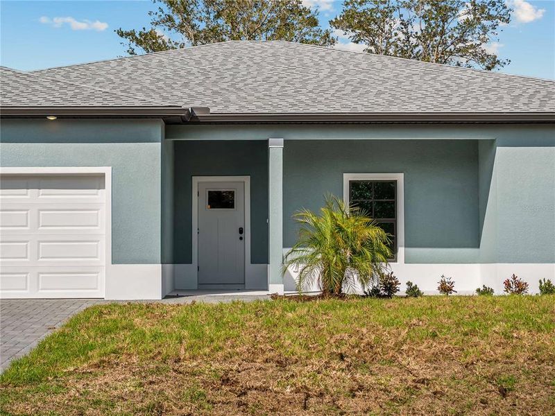 Exterior details and patio area of a home in , North Port (Image 37).