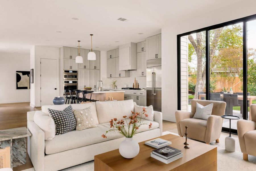 Living area featuring baseboards and recessed lighting Living area featuring baseboards and recessed lighting
