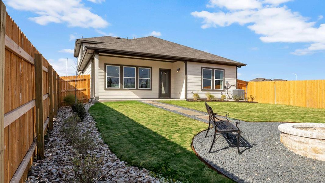Front exterior of a new home in Carillon, Manor, TX, highlighting curb appeal (Image 2).