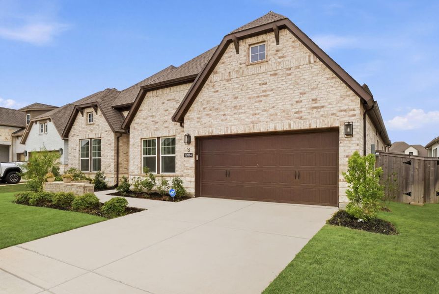 Front exterior of a new home in , Cypress, TX, highlighting curb appeal (Image 26). Front exterior of a new home in , Cypress, TX, highlighting curb appeal (Image 26).