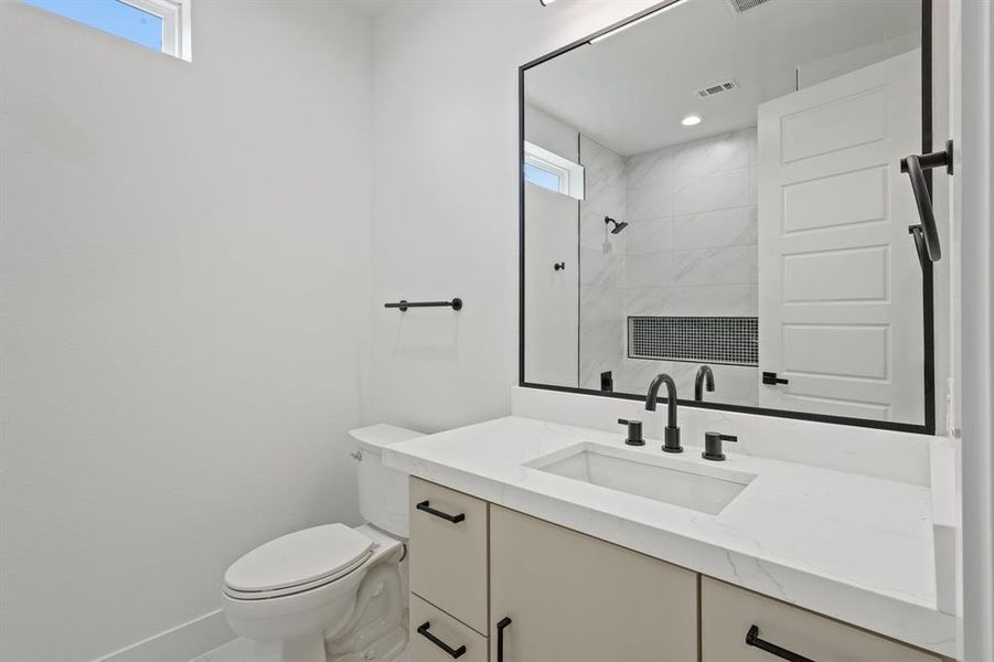 Bathroom featuring toilet and vanity