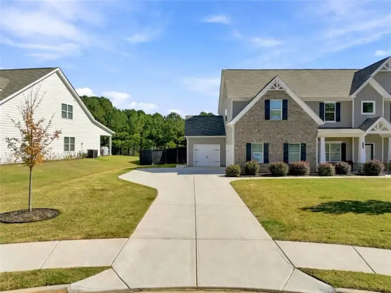Front exterior of a new home in Joel's Landing, Monroe, GA, highlighting curb appeal (Image 22).