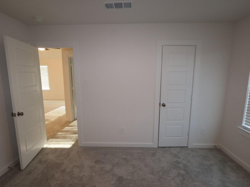 Spacious, unfurnished interior of a new home in Pinewood at Grand Texas, New Caney (Image 26).