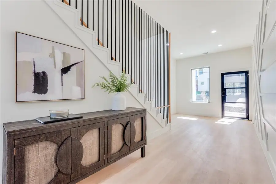 Entrance foyer featuring recessed lighting and light wood finished floors