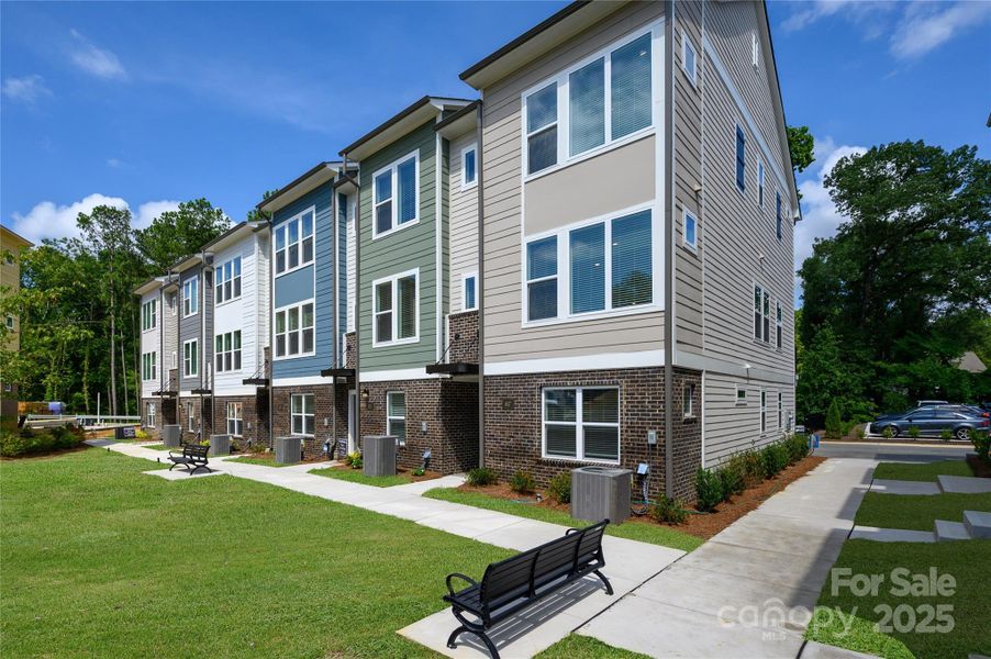 Front exterior of a new home in Central Living at Craig, Charlotte, NC, highlighting curb appeal (Image 21).