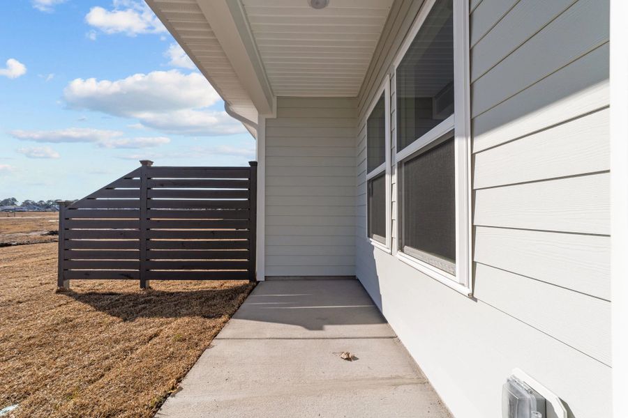 Exterior details and patio area of a home in Blue Heron Retreat: Villas, Little River (Image 4).
