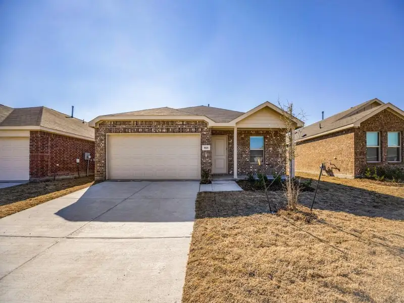 Front exterior of a new home in , Forney, TX, highlighting curb appeal (Image 1). Front exterior of a new home in , Forney, TX, highlighting curb appeal (Image 1).