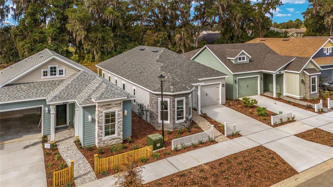 Front exterior of a new home in Fairway Pointe at West End, Newberry, FL, highlighting curb appeal (Image 24).